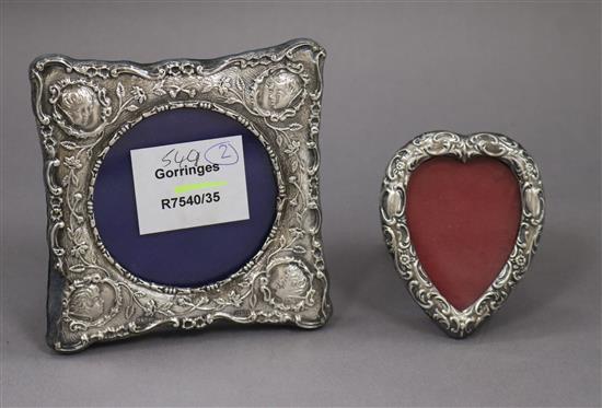 Two small silver mounted photograph frames, one heart shaped.